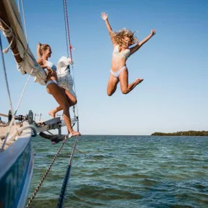 a man riding on the back of a boat