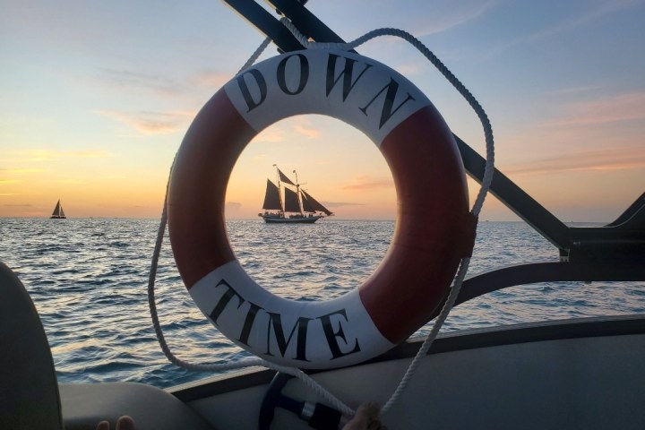 a close up of a boat next to a body of water